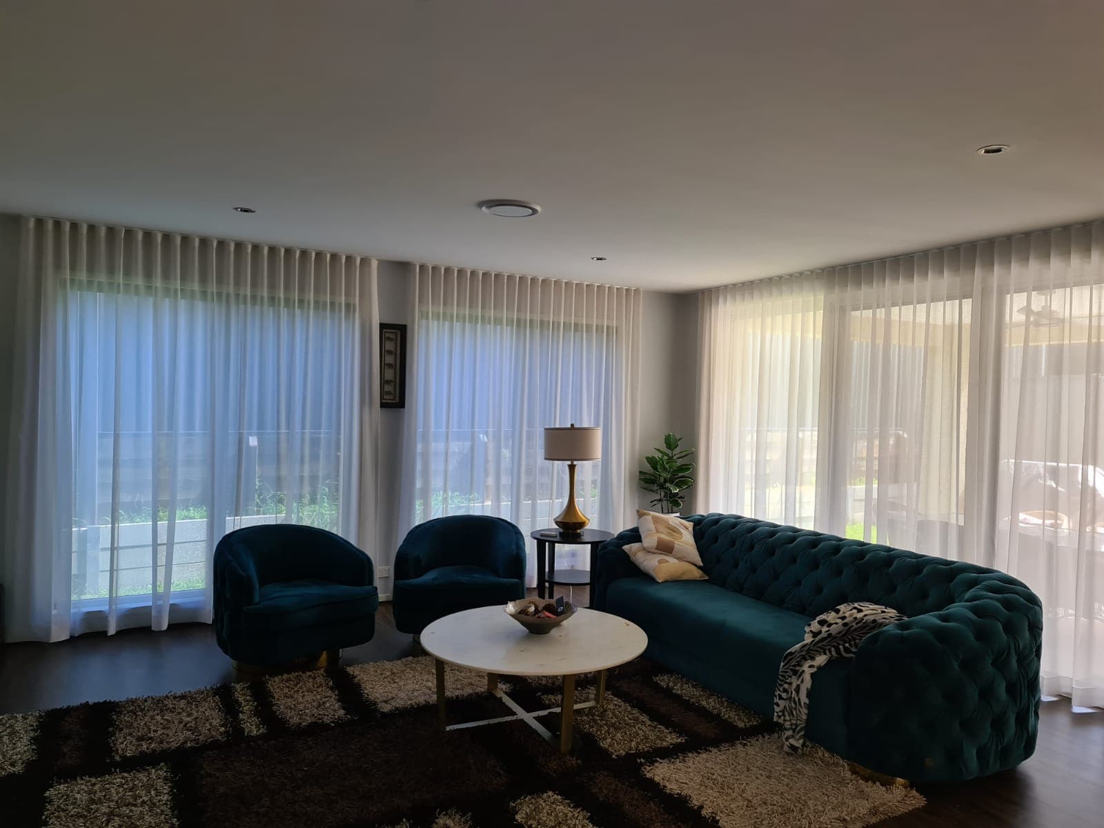 Sheer curtains and blinds installed in a Gold Coast living room
